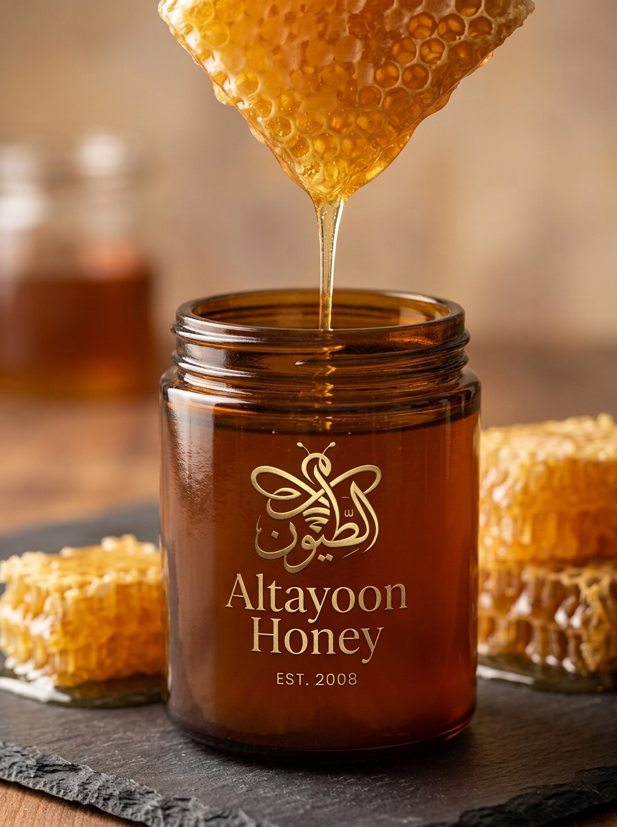 Artisan honeycomb dripping amber honey into a dark glass jar